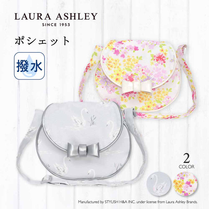 カラフルキャンディスタイルの持って可愛い丸型ポシェット。リボンのチャームがアクセント