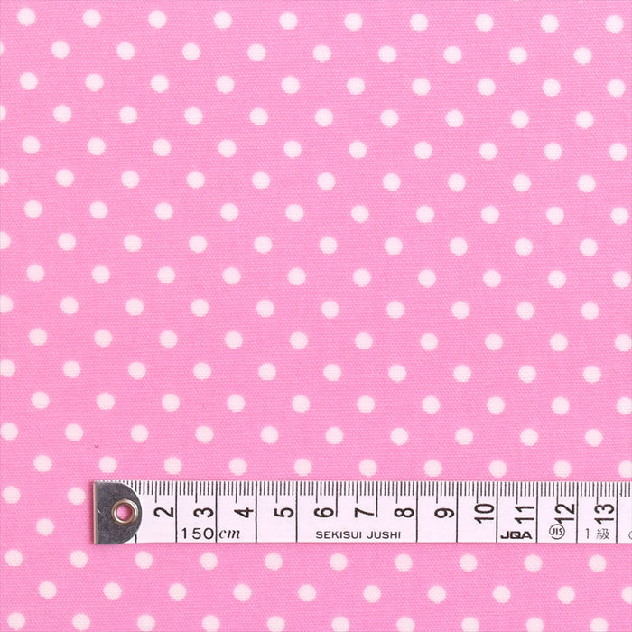 Polka dots (white dots on pink background) laminated (thickness 0.2mm) fabric 
