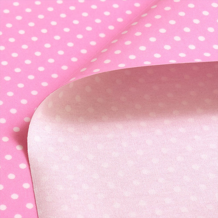 Polka dots (white dots on pink background) laminated (thickness 0.2mm) fabric 